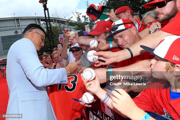 Manny Machado of the Baltimore Orioles and the American signs autographs for fans at the 89th MLB All-Star Game, presented by MasterCard red carpet...