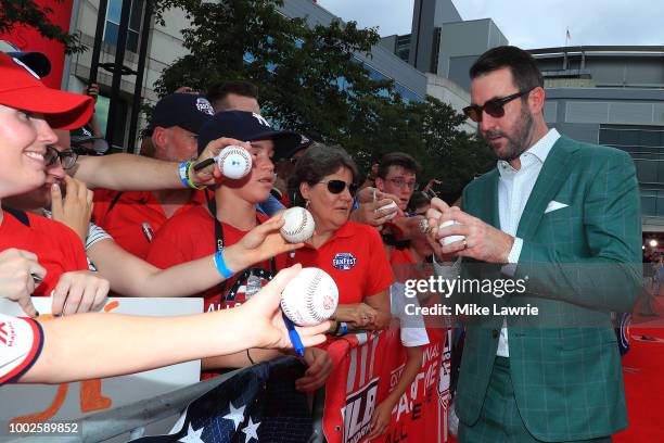 Justin Verlander of the Houston Astros and the American League signs autographs for fans at the 89th MLB All-Star Game, presented by MasterCard red...