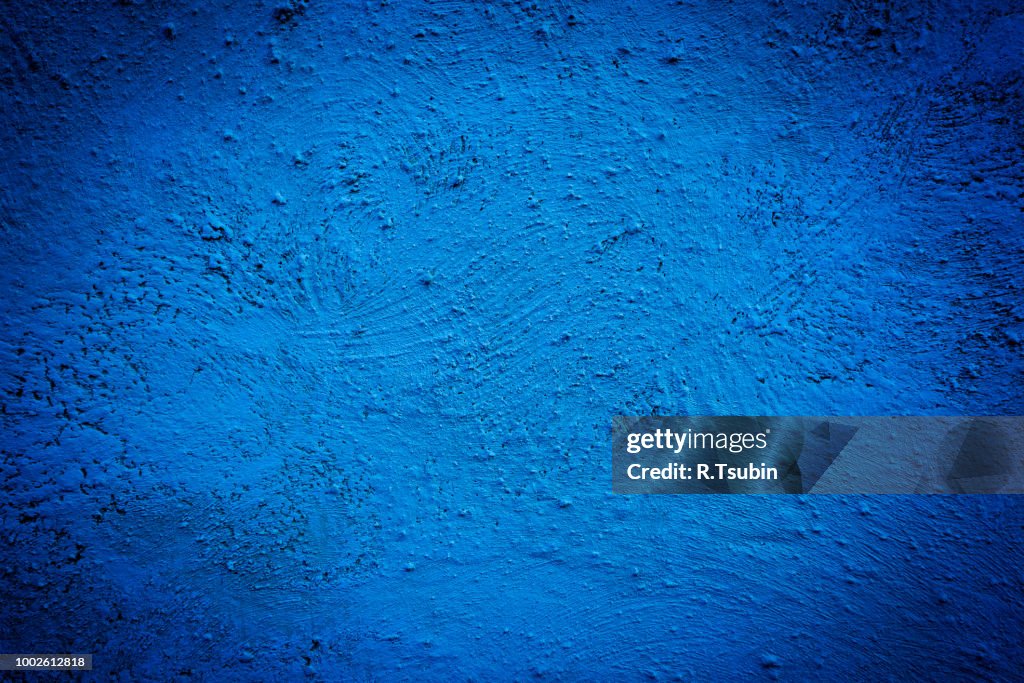 Blue background wall texture with dark edges