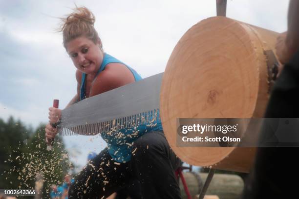 Lindsay Daun of Round Lake, Illinois competes in a Double Buck sawing competition at the Lumberjack World Championships on July 19, 2018 in Hayward,...