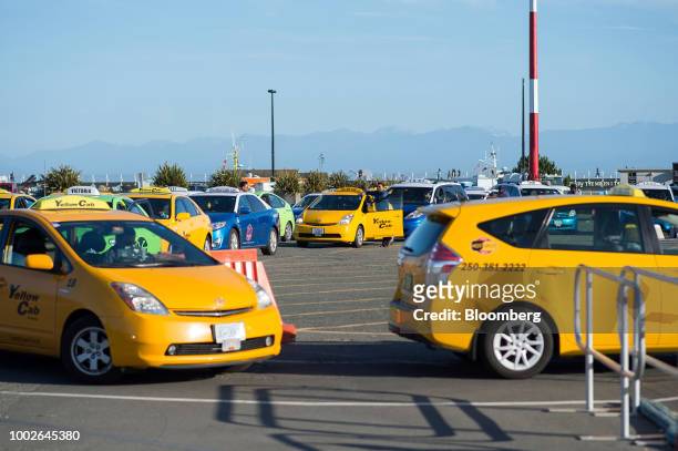 Taxi drivers wait for passengers at the Ogden Point Cruise Terminal in Victoria, British Columbia, Canada, on Friday, July 13, 2018. Canadian tourism...