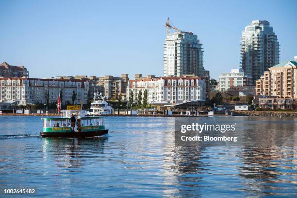 Ferry transports visitors across Victoria Harbour in Victoria, British Columbia, Canada, on Friday, July 13, 2018. Canadian tourism spending rose...