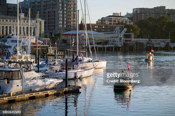 Water taxis travel through Victoria Harbour in Victoria, British Columbia, Canada, on Friday, July 13, 2018. Canadian tourism spending rose 0.2% in...