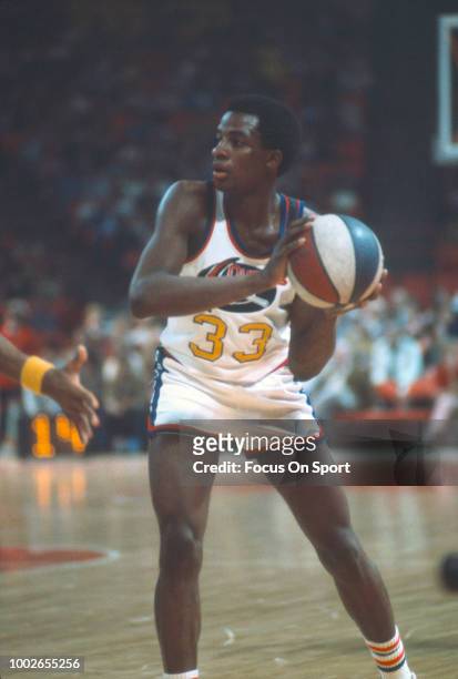 David Thompson of the Denver Nuggets looks to pass the ball against the Indiana Pacers during an ABA basketball game circa 1975 at McNichols Sports...