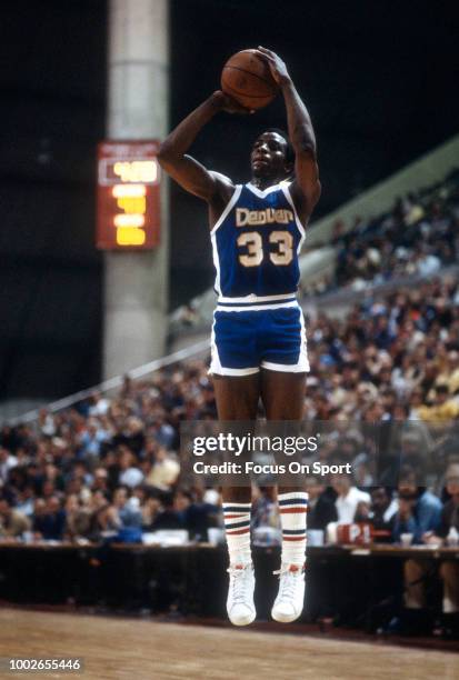 David Thompson of the Denver Nuggets shoots against the New Jersey Nets during an NBA basketball game circa 1979 at the Rutgers Athletic Center in...