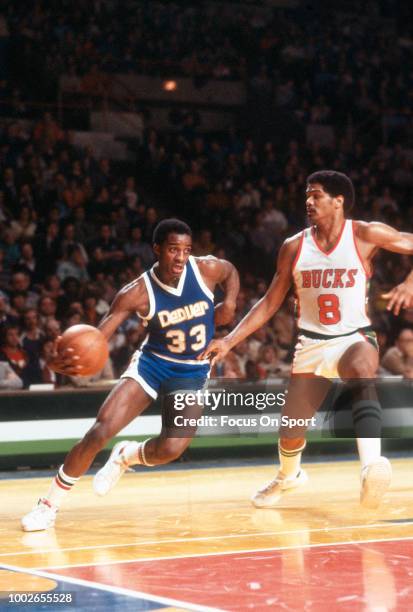 David Thompson of the Denver Nuggets drives on Marques Johnson of the Milwaukee Bucks during an NBA basketball game circa 1978 at the MECCA Arena in...