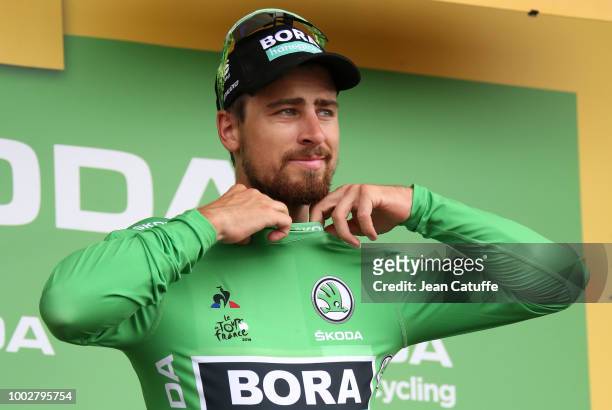 Peter Sagan of Slovakia and Team Bora-Hansgrohe retains the green jersey of best sprinter on the podium following stage 13th of Le Tour de France...