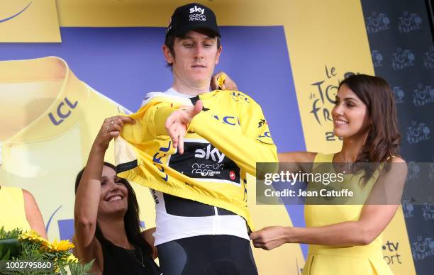 Geraint Thomas of Great Britain and Team Sky retains the yellow jersey of race's leader on the podium following stage 13th of Le Tour de France 2018...
