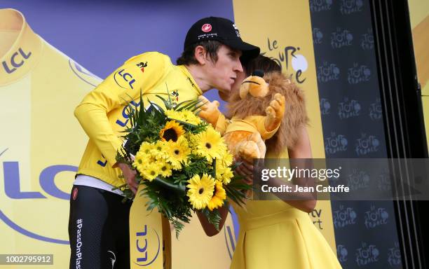 Geraint Thomas of Great Britain and Team Sky retains the yellow jersey of race's leader on the podium following stage 13th of Le Tour de France 2018...