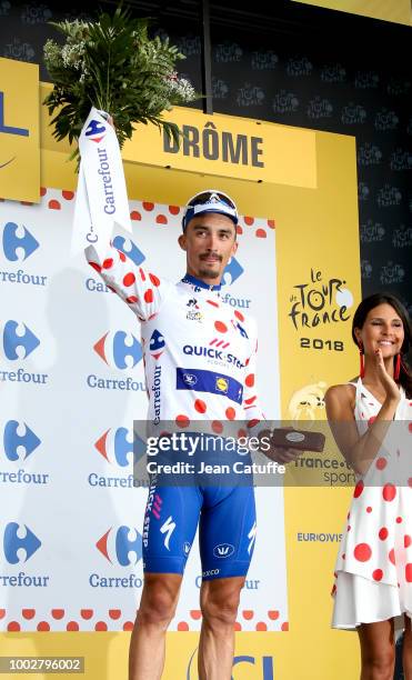 Julian Alaphilippe of France and Quick Step Floors retains the dot jersey of best climber on the podium following stage 13th of Le Tour de France...