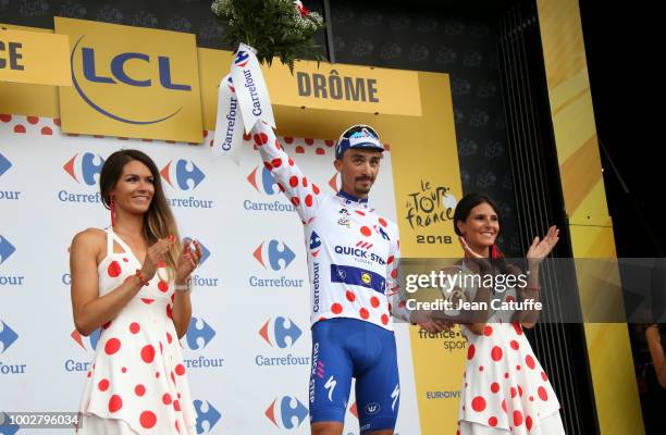 Julian Alaphilippe of France and Quick Step Floors retains the dot jersey of best climber on the podium following stage 13th of Le Tour de France...