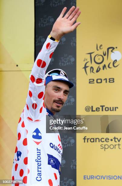 Julian Alaphilippe of France and Quick Step Floors retains the dot jersey of best climber on the podium following stage 13th of Le Tour de France...