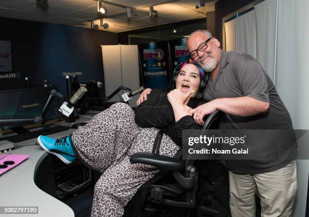 Singer Netta Barzilai poses with host Larry Flick at the SiriusXM Studios on July 20, 2018 in New York City.