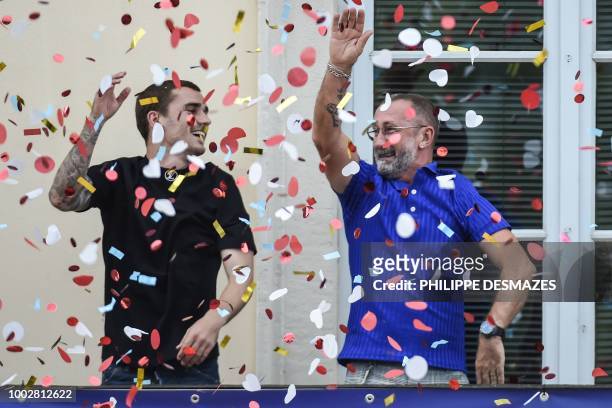 French football player Antoine Griezmann and his father Alain greet fans in his hometown of Macon, eastern France, on July 20, 2018 after France won...