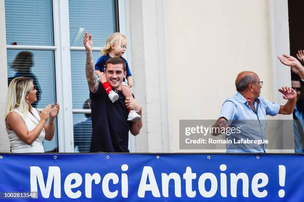 Antoine Griezmann and his daughter Mia Griezmann celebrate France victory in World Cup in his hometown on July 20, 2018 in Macon, France.