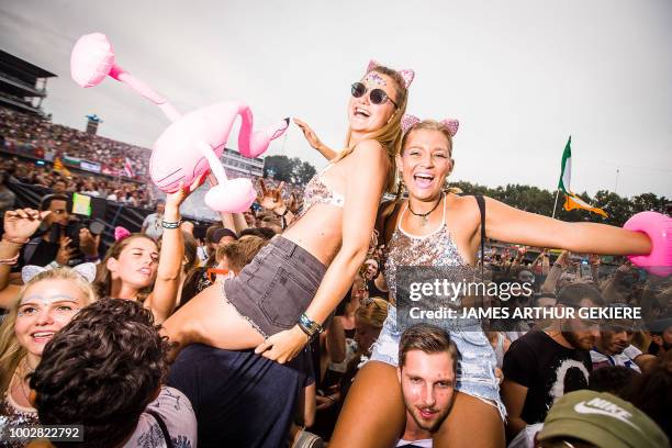 People enjoy the first day of the Belgian electronic music festival Tomorrowland, on July 20 in Boom. - The 14th edition of Tomorrowland electronic...