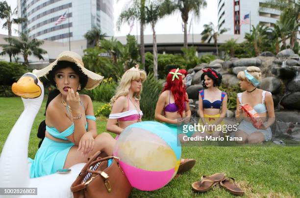 Cosplayers are dressed as the Disney princesses outside Comic-Con on July 20, 2018 at the San Diego Convention Center in San Diego, California. More...
