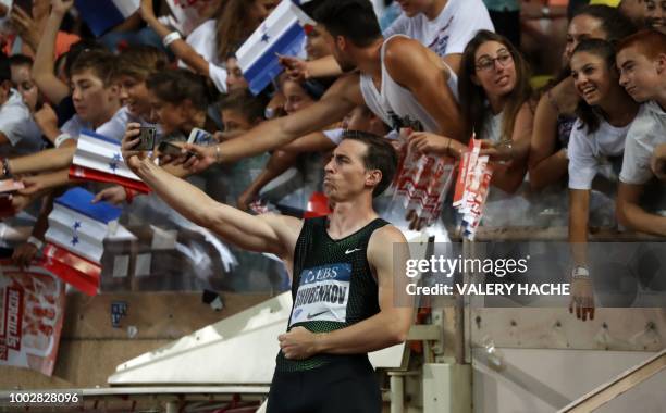 Authorised Neutral Athlete Sergey Shubenkov takes a 'selfie' as he celebrates after victory in the men's 110 metre hurdles during the IAAF Diamond...