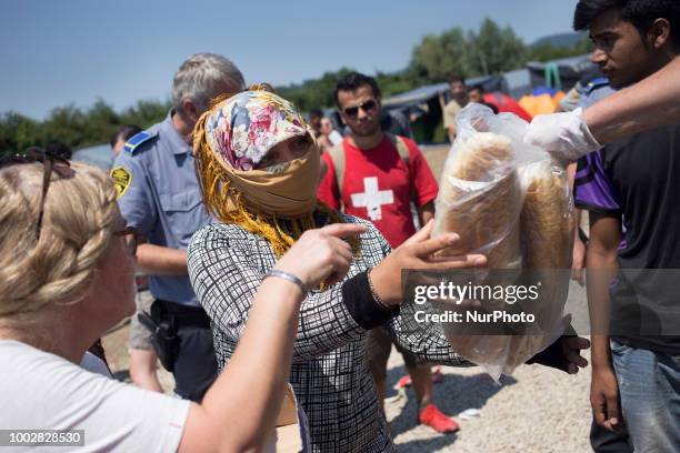 Red Cross shares a food for immigrants in Refugee camp in Velika Kladusa, BiH on July 20, 2018.