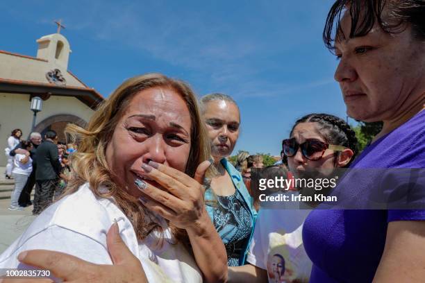 Concepcion Ramirez, left, grand mother of 10-year-old Anthony Avalos, weeps at the end of funeral services held at Saint Junipero Serra Parish on...