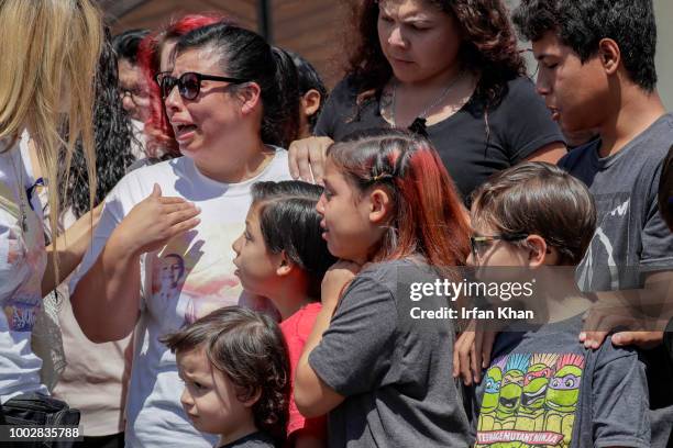 Grieving family members weep as pallbearers bring out the casket of 10-year-old Anthony Avalos after funeral services held at Saint Junipero Serra...