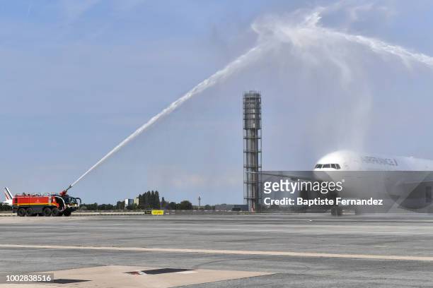 Team France plane is welcomed by a water salute during the arrival at Airport Roissy Charles de Gaulle on July 16, 2018 in Paris, France.