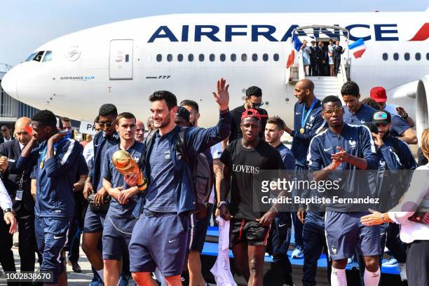 Team France with the trophy during the arrival at Airport Roissy Charles de Gaulle on July 16, 2018 in Paris, France.