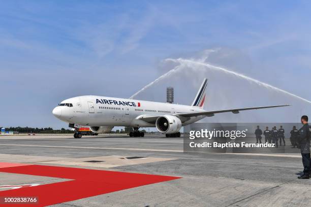 Team France plane is welcomed by a water salute during the arrival at Airport Roissy Charles de Gaulle on July 16, 2018 in Paris, France.
