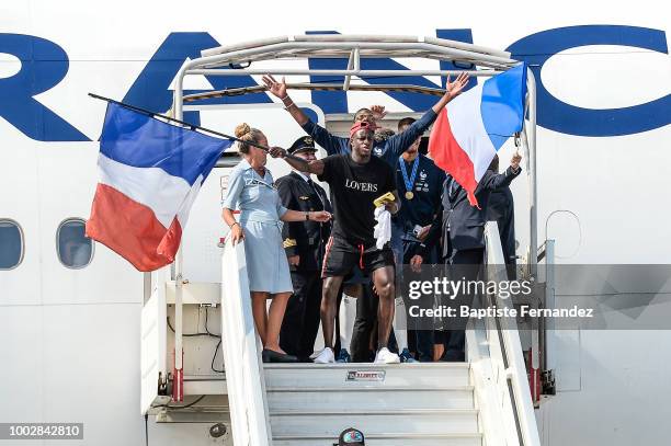 Paul Pogba and Benjamin Mendy of France during the arrival at Airport Roissy Charles de Gaulle on July 16, 2018 in Paris, France.