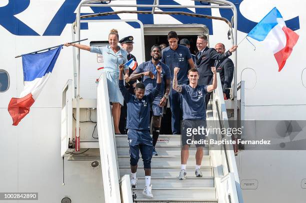 Raphael Varane, Samuel Umtiti, Ousmane Dembele and Antoine Griezmann of France during the arrival at Airport Roissy Charles de Gaulle on July 16,...