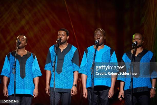 Members of South-African band Ladysmith Black Mambazo perform live on stage on stage at Columbia Theater on July 20, 2018 in Berlin, Germany.