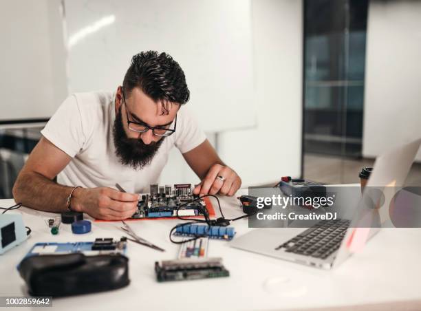 Guy Using Multimeter Desktop Multimeter Photos and Premium High Res Pictures - Getty Images