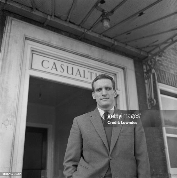 Welsh professional footballer and captain of Peterborough United, Vic Crowe pictured leaving hospital after recovering from injury on 9th March 1965.
