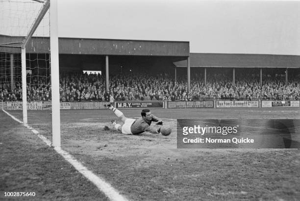 Scottish professional footballer and goalkeeper with Peterborough United FC, Willie Duff pictured making a save during a match between Walsall FC and...
