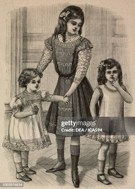 Child of 1-3 years dressed in batiste; an 8-10 year old girl in a striped fabric dress; a 2-4 year old girl in a dress with ruffles, engraving from...