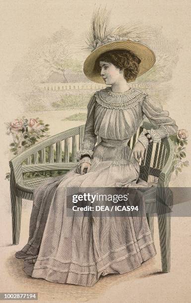 Woman wearing a white Voile dress, pleated skirt and corset; hat with ribbons and feathers, creation by Drecoll, colored engraving from La Mode...