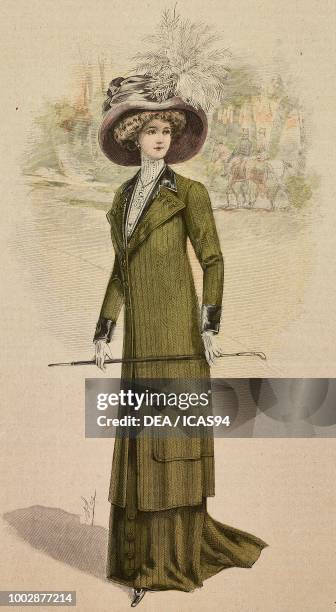 Woman wearing a mid season dress in Cheviot fabric, half train skirt, coat with lapels, hat with feathers, creation by High Life Tailor, engraving...