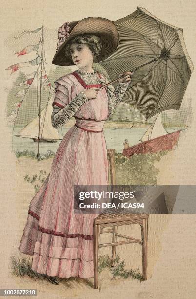 Woman wearing a pink fine linen dress, skirt with small pleats, corset with lace and silk inserts; hat with ribbon, creation by Drecoll, colored...