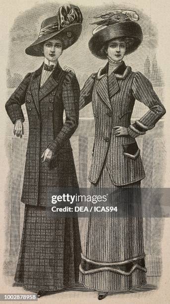 Woman wearing a checkered woolen dress, long jacket and a hat with ribbons; woman wearing a woolen trotteur dress, fur inserts and a hat with...