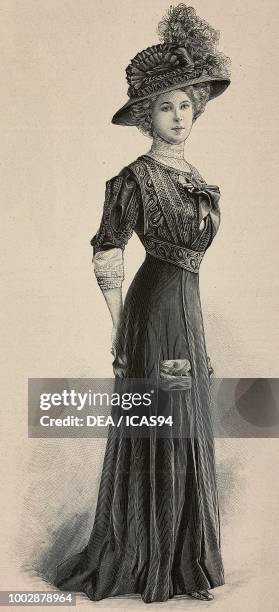 Woman wearing an afternoon dress, pleated skirt, corset with lace and a hat with feathers, creation by High Life Tailor, engraving from La Mode...