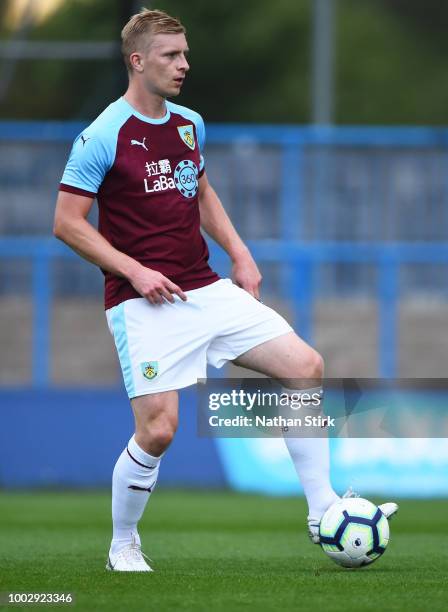 Ben Mee of Burnley in action during a pre-season friendly match between Curzon Ashton and Burnley at Tameside Stadium on July 20, 2018 in Ashton...