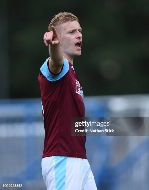 Ben Mee of Burnley gives his team mates instructions during a pre-season friendly match between Curzon Ashton and Burnley at Tameside Stadium on July...