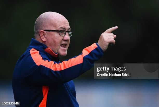 John Flanagan, manager of Curzon Ashton gives his players instructions during a pre-season friendly match between Curzon Ashton and Burnley at...