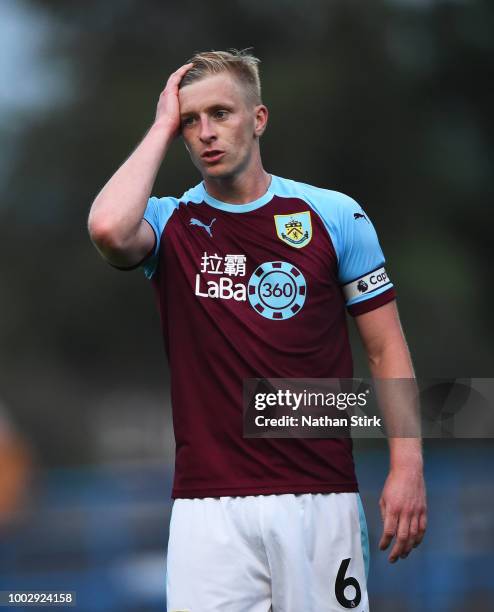 Ben Mee of Burnley looks on during a pre-season friendly match between Curzon Ashton and Burnley at Tameside Stadium on July 20, 2018 in Ashton under...