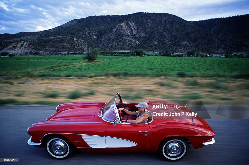 WOMAN DRIVING CORVETTE, WESTERN COLORADO