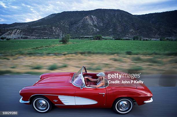 woman driving corvette,  western colorado - classic cars stock pictures, royalty-free photos & images