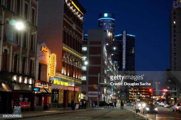 nightlife activity on the busy downtown city street - detroit michigan stock pictures, royalty-free photos & images