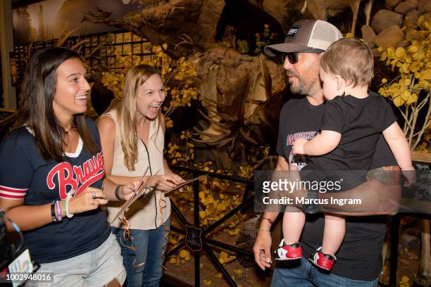 Country music super-star Jason Aldean surprise Rachel Hood and Heather Wallace with VIP concert tickets and a shopping spree at Field & Stream Shop...