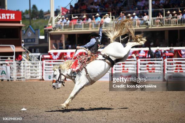 Saddle bronc rider Layton Green of Meeting Creek, AB, competes at the Calgary Stampede on July 15, 2018 at Stampede Park in Calgary, AB.