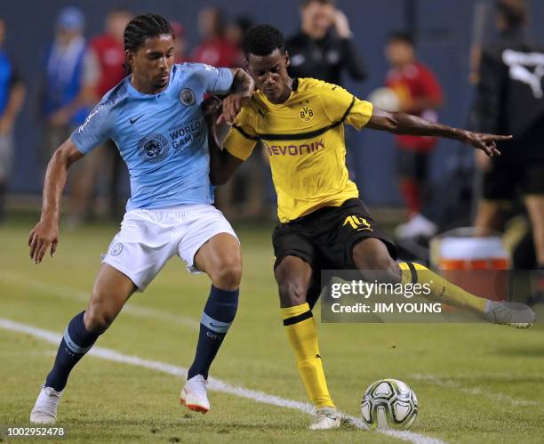 Manchester City's Jason Denayer vies for the ball with Borussia Dortmund's Alexander Isak during the 2018 International Champions Cup at Soldier...